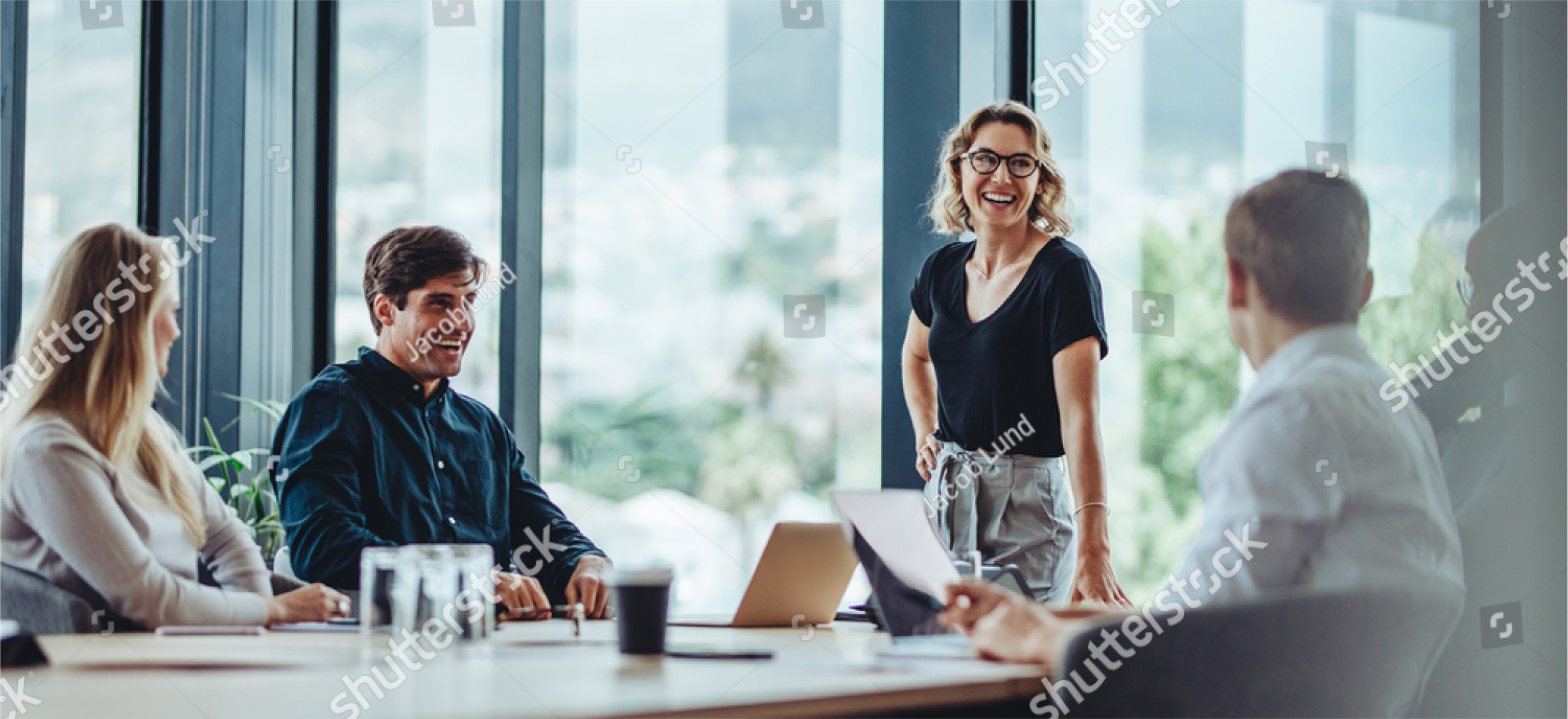 stock-photo-office-colleagues-having-casual-discussion-during-meeting-in-conference-room-group-of-men-and-1791564398